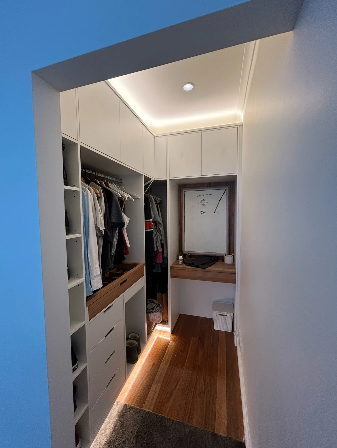 LED strip lighting around wardrobe cabinetry and along the floor
